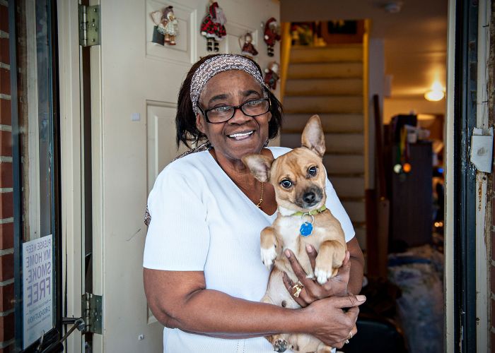 Woman at front door with dog