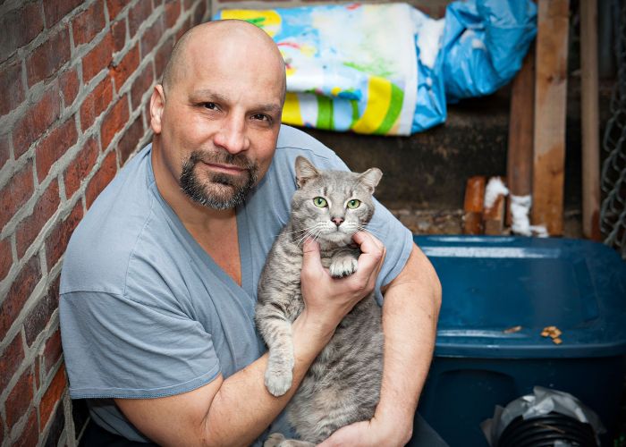 Man with grey cat