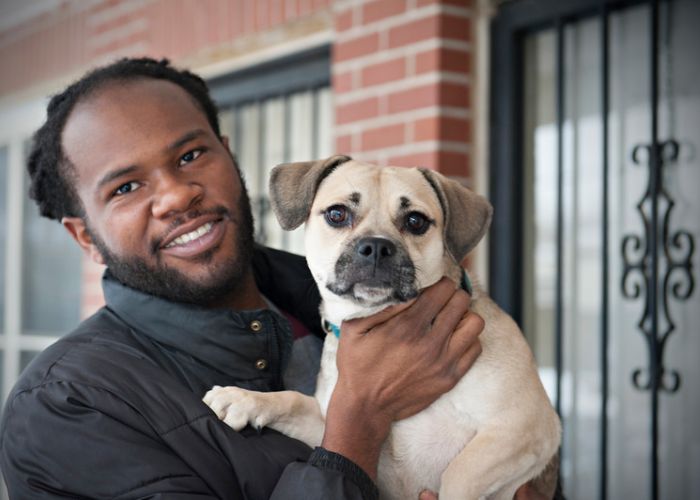 Man holding dog