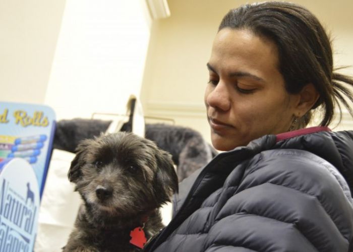 a woman holding her dog